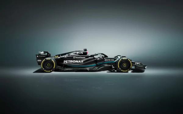 HD desktop wallpaper featuring a sleek Mercedes W14 Formula 1 car in a moody, illuminated setting.