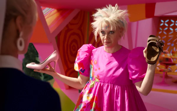 Kate McKinnon in a vibrant pink dress holds up two shoes, contrasting styles, set against a colorful background from the movie Barbie (2023). Bright and playful HD wallpaper.