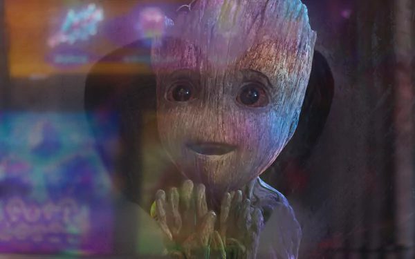 A vibrant HD wallpaper featuring Baby Groot from the TV show I Am Groot, showcasing his charming expression against a colorful, abstract background.