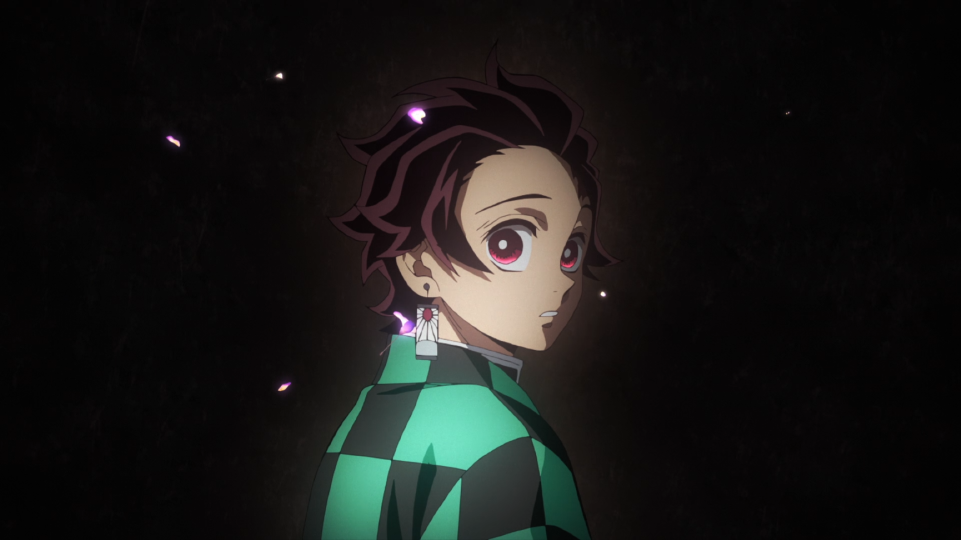 HD PC desktop wallpaper featuring Tanjiro Kamado from the anime Demon Slayer: Kimetsu no Yaiba, highlighting his detailed expression against a dark background.