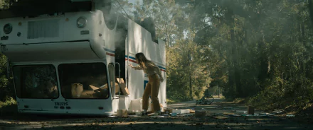HD desktop wallpaper featuring a dramatic scene with a person escaping a smoking vehicle wreck, conveying a sense of urgency and survival, tagged with 'No One Will Save You'.