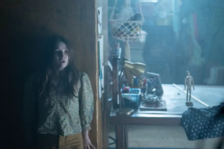 HD wallpaper of a tense scene with a woman in a dark, cluttered room, tagged No One Will Save You.