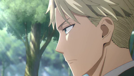 HD desktop wallpaper featuring a close-up, profile view of Loid Forger from Spy x Family, set against a blurred natural background.