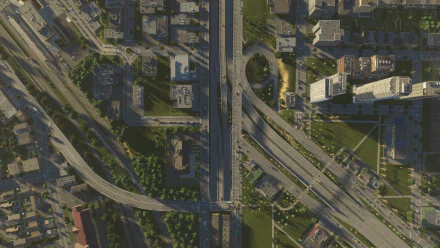 High-definition desktop wallpaper featuring an intricate cityscape from Cities: Skylines II with detailed roadways and urban buildings.