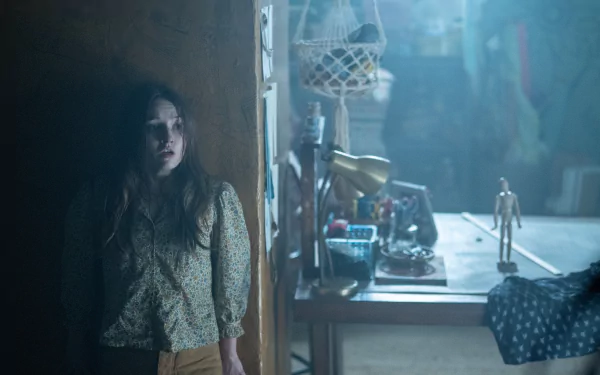 HD wallpaper of a tense scene with a woman in a dark, cluttered room, tagged No One Will Save You.