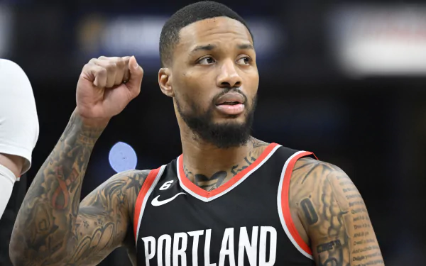 HD wallpaper featuring Damian Lillard of the Portland Trail Blazers, showcasing his determination and athleticism on the basketball court.