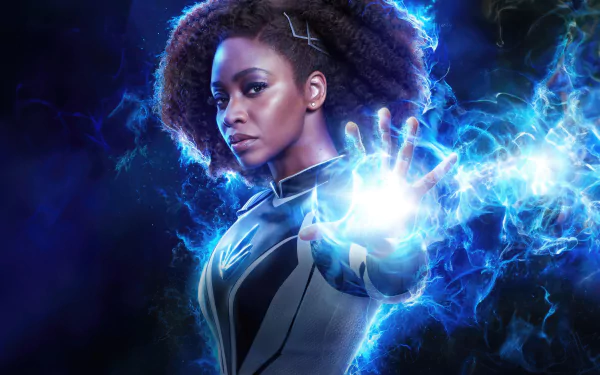 HD movie desktop wallpaper featuring a character from The Marvels, showcasing a powerful pose with energy radiating from her hand.