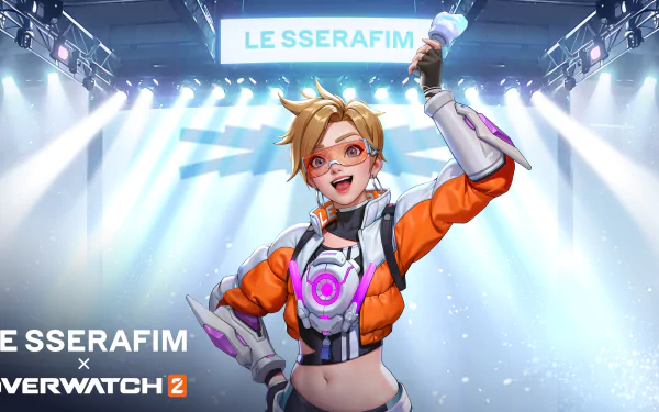HD desktop wallpaper featuring Tracer from Overwatch 2 with vibrant stage lights in the background.