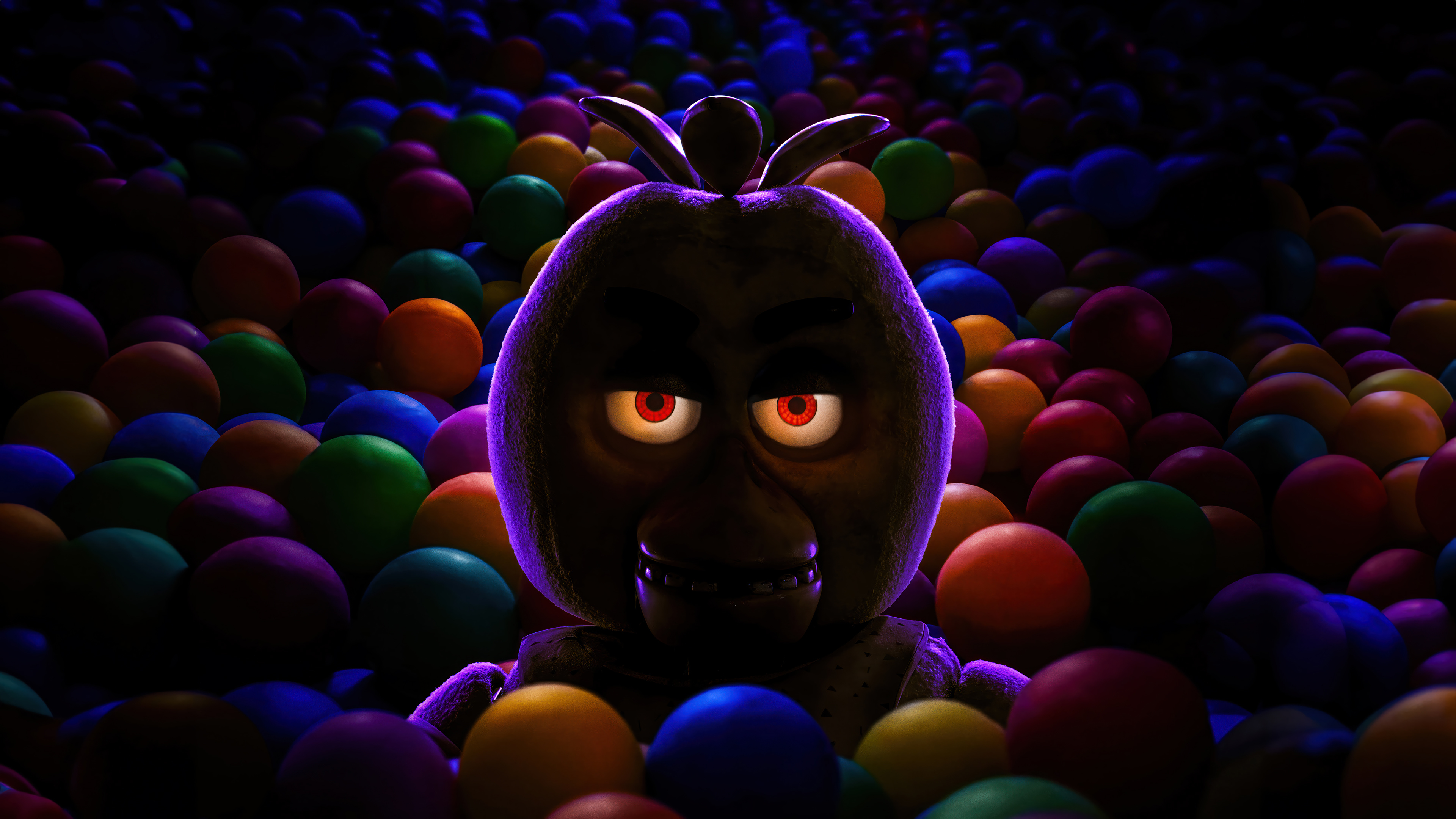 HD desktop wallpaper of Five Nights at Freddy's character emerging from colorful ball pit with sinister glowing eyes.
