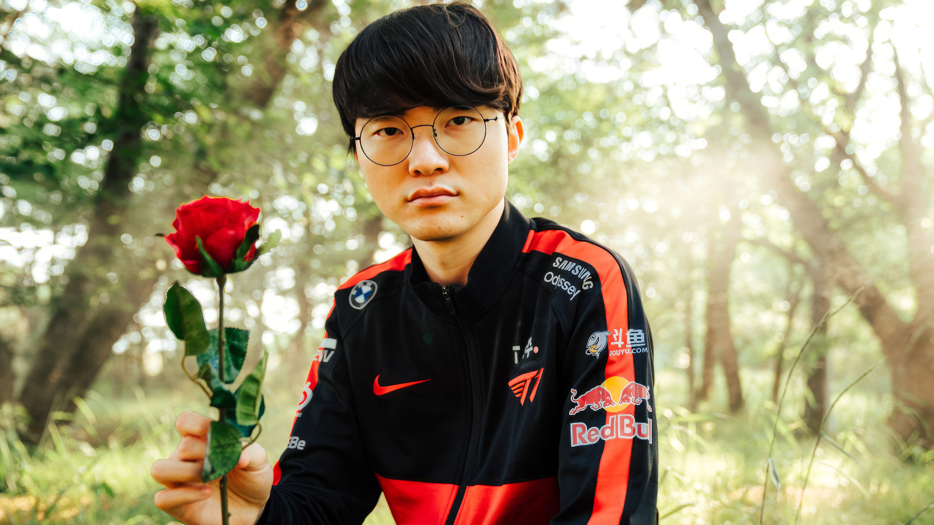 HD wallpaper of a professional eSports player from League of Legends team T1, holding a rose, with nature background.