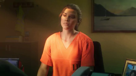 Person in orange attire posing for a HD desktop wallpaper with a softly lit, cozy background.