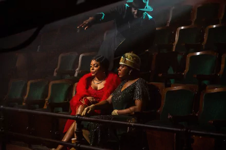 Two characters from the 2023 movie The Color Purple sitting contemplatively in a theater, featured in a high-definition desktop wallpaper.
