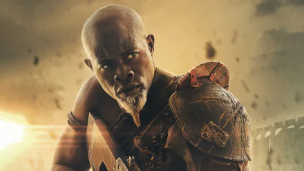 HD wallpaper featuring an intense character from Rebel Moon movie, depicting a warrior in armor with a cinematic backdrop.