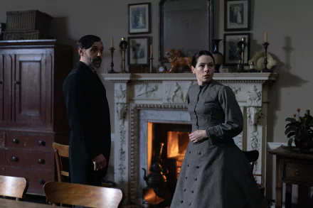 HD wallpaper featuring a scene from Belgravia: The Next Chapter with two characters in a dimly lit Victorian room with a fireplace.