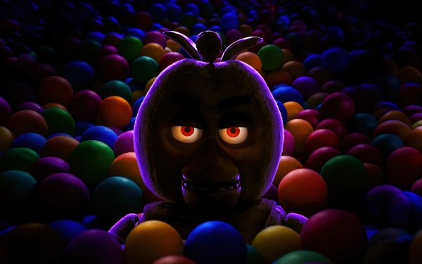 HD desktop wallpaper of Five Nights at Freddy's character emerging from colorful ball pit with sinister glowing eyes.