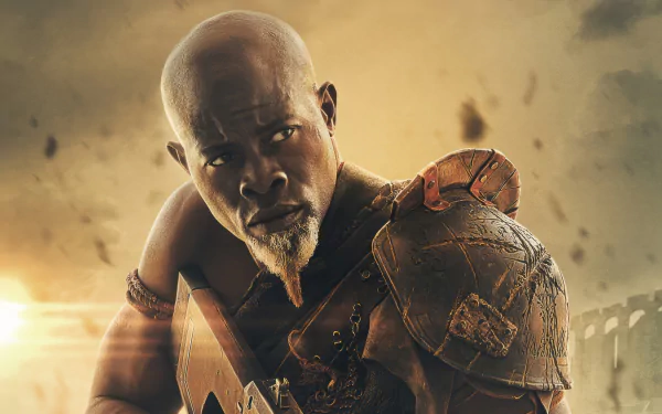 HD wallpaper featuring an intense character from Rebel Moon movie, depicting a warrior in armor with a cinematic backdrop.