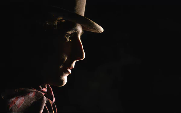 Silhouette of a man in a hat reminiscent of Wonka character, HD movie-themed desktop wallpaper.