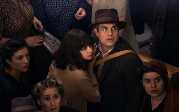 HD wallpaper featuring a scene from the TV show 'All the Light We Cannot See' with actors portraying characters in a tense, crowded setting.