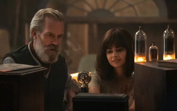 HD wallpaper featuring a scene from the TV show 'All the Light We Cannot See' with two characters engaging with a radio apparatus, creating a warm and intriguing ambiance.