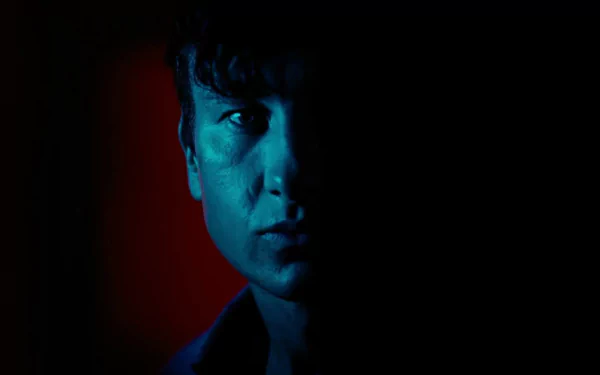 HD desktop wallpaper featuring a dramatic blue-lit scene from the movie Saltburn (2023).