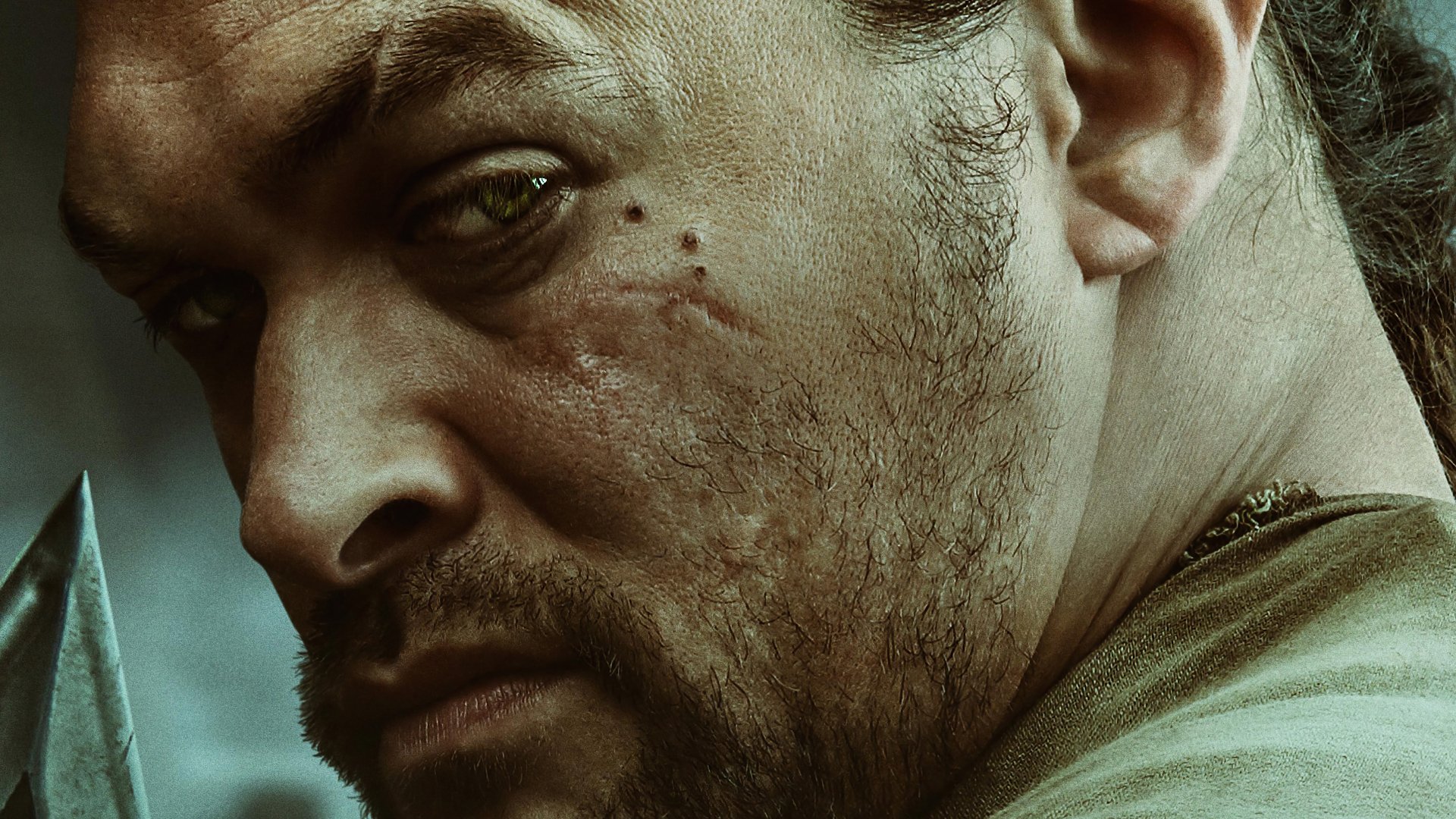 HD wallpaper featuring a close-up from the 2021 movie Dune, showcasing a determined character portrayed by the actor associated with the role.