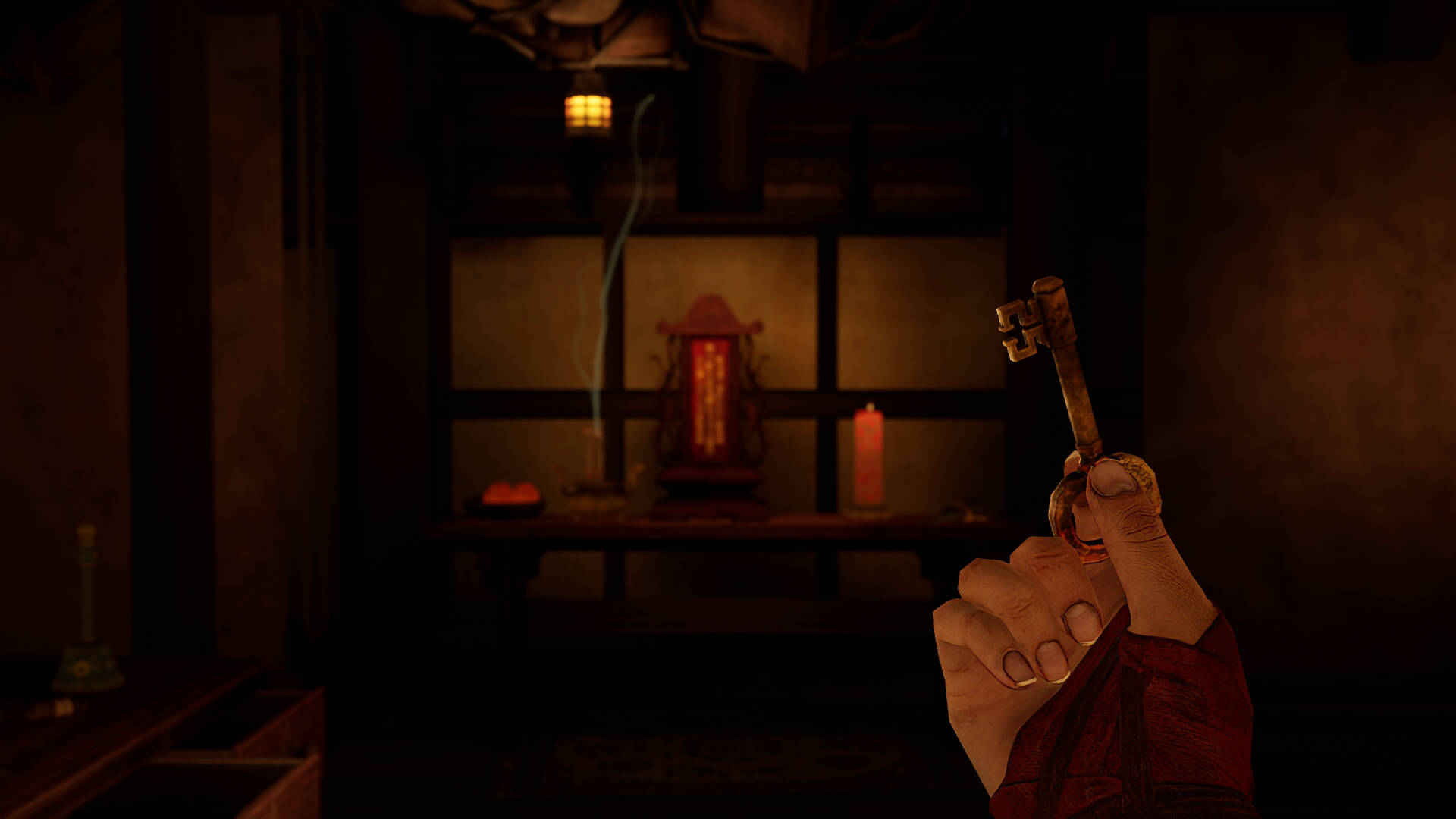 HD wallpaper from 'The Pirate Queen: A Forgotten Legend' video game depicting a first-person view of a hand holding a key, with a dimly lit room featuring shelves, an oriental lantern, and candles in the background.
