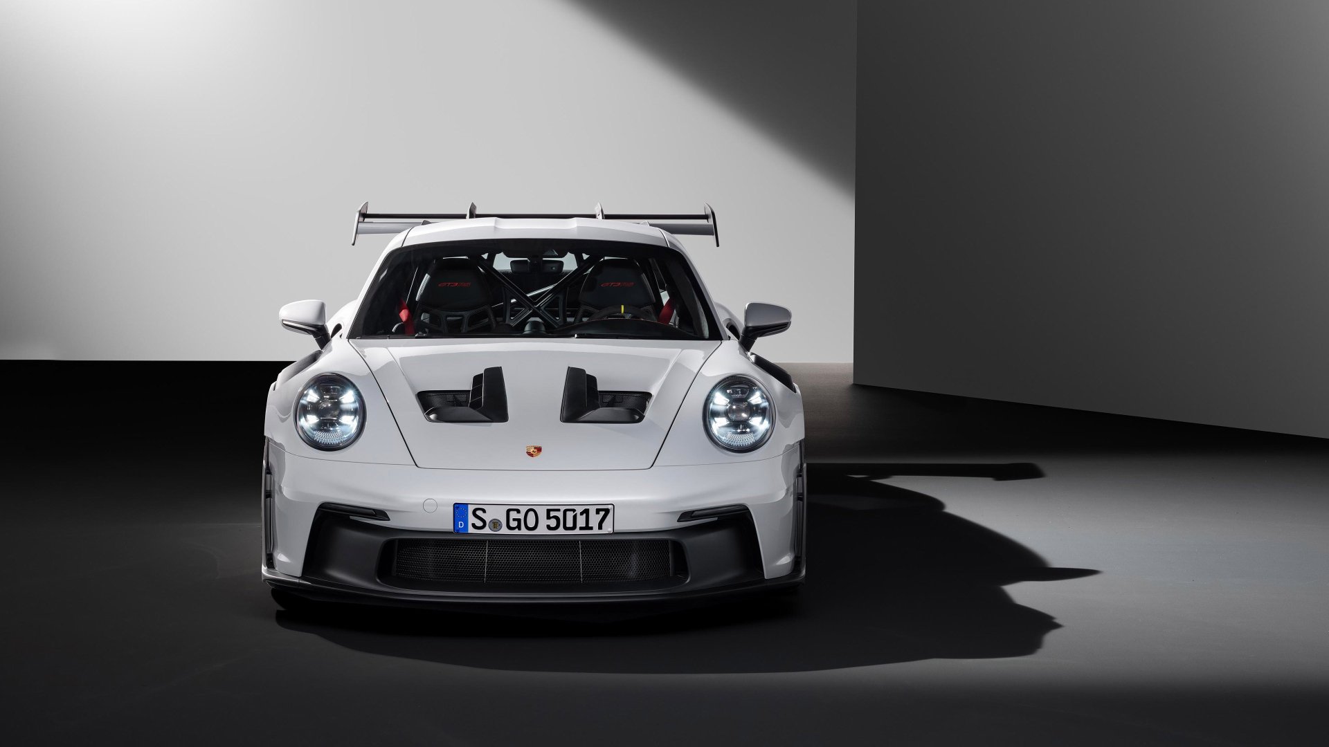 HD desktop wallpaper of a Porsche 911 GT3 RS car, showcasing the vehicle in a sleek, high-contrast setting.