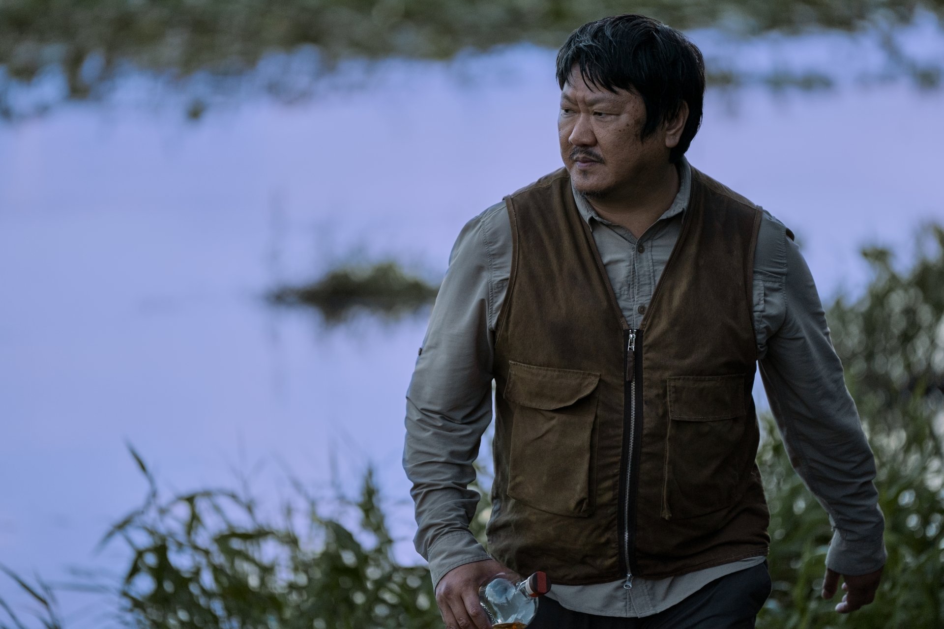 Actor Benedict Wong in a scene from the TV show '3 Body Problem', presented as a high-definition desktop wallpaper with a wintry backdrop.