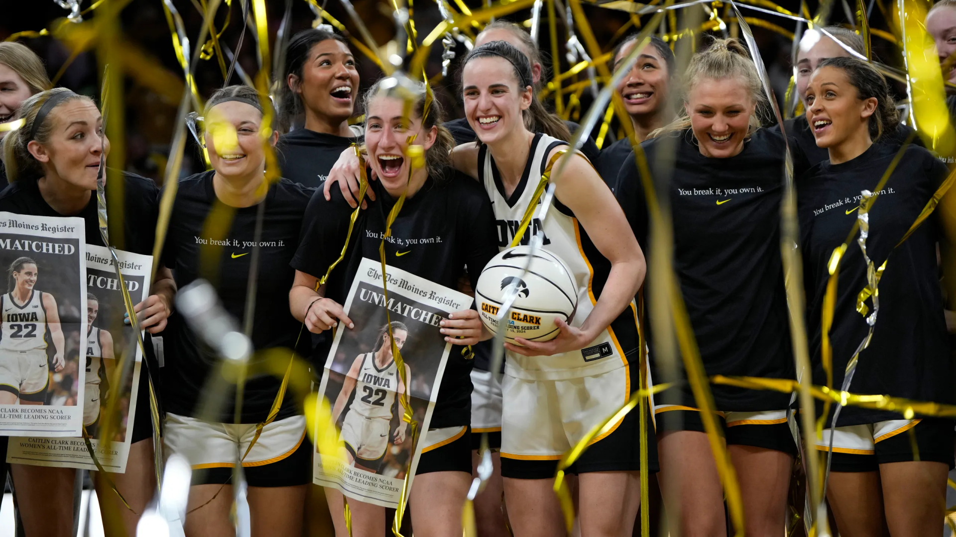 HD wallpaper of basketball player Caitlin Clark celebrating with teammates among golden confetti.
