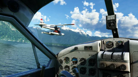Stunning HD desktop wallpaper featuring the cockpit view of a plane in Microsoft Flight Simulator, capturing a majestic scene of mountains and a flying seaplane.