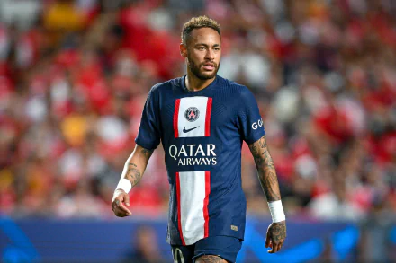 HD wallpaper of a professional soccer player on the field wearing a blue and red jersey with Qatar Airways sponsor logo, suitable as a desktop background.