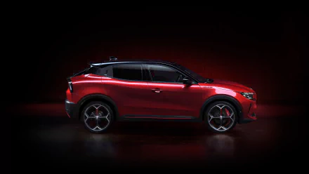 Alfa Romeo Milano Veloce parked against a dark background, showcased as a sleek red HD desktop wallpaper.