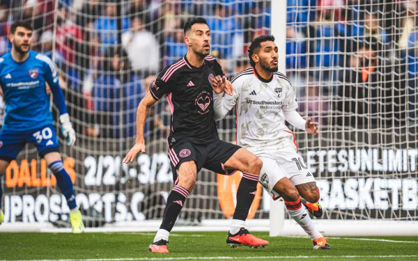 Sergio Busquets in action during an Inter Miami CF soccer match captured as a high-definition desktop wallpaper background.