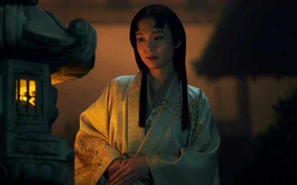 HD wallpaper featuring a scene from the 2024 TV show Shogun, with a serene woman in traditional attire by a lit lantern.