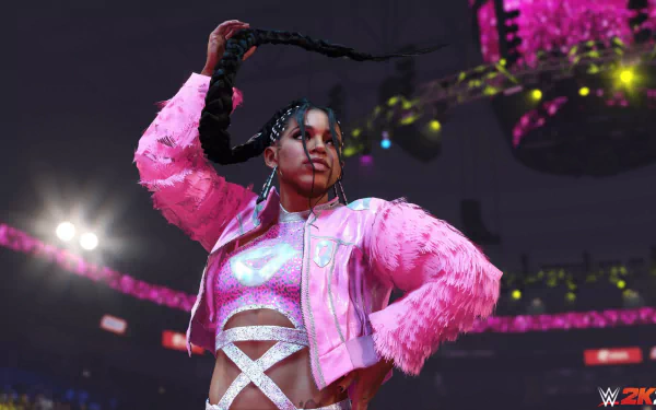 HD desktop wallpaper featuring a WWE 2K24 video game female wrestler in a victory pose with a pink jacket in an arena setting.