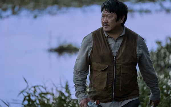 Actor Benedict Wong in a scene from the TV show '3 Body Problem', presented as a high-definition desktop wallpaper with a wintry backdrop.