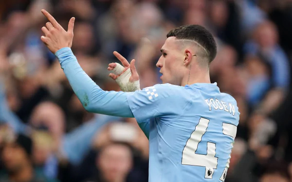 Manchester City F.C. soccer player celebrating on the pitch, wearing number 47 jersey, in a high-definition desktop wallpaper.