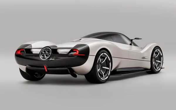 HD desktop wallpaper featuring a rear three-quarter view of a silver Pagani Huayra, highlighting its sleek design and distinctive circular taillights against a clean, neutral background.