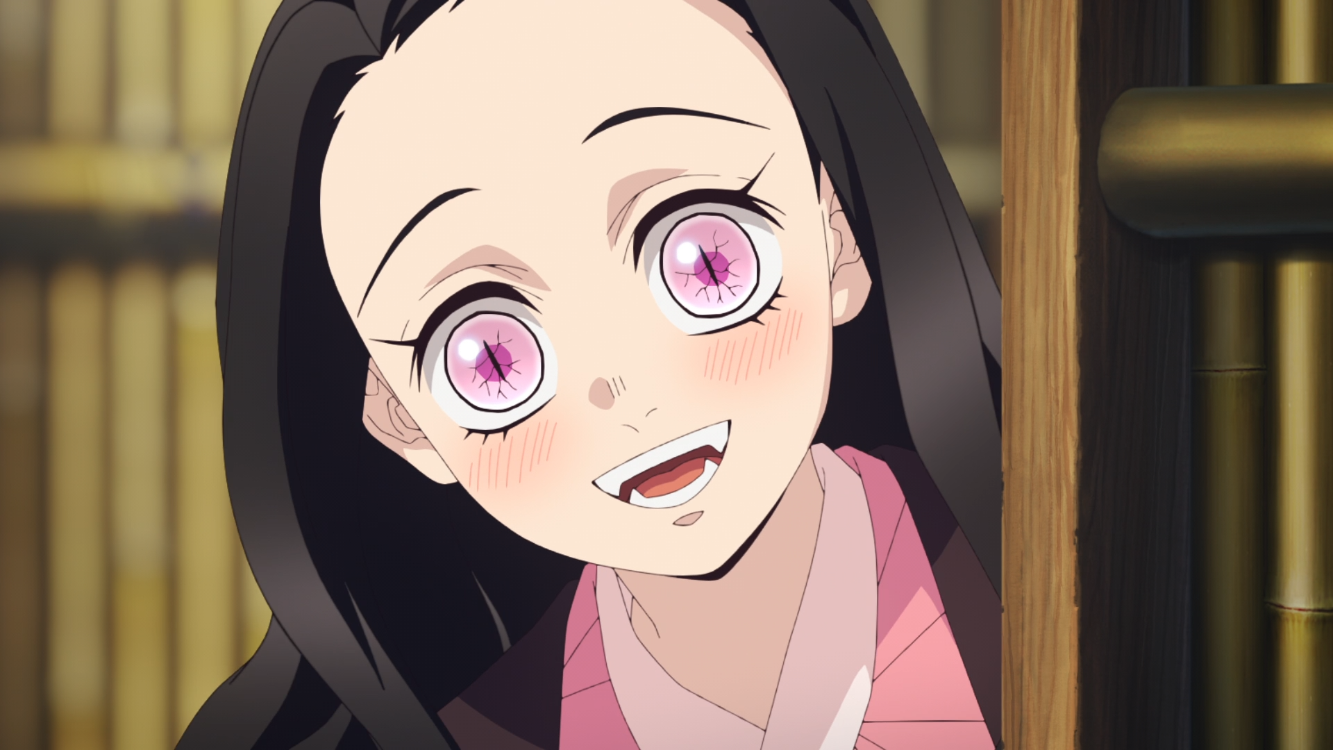 HD anime desktop wallpaper featuring Nezuko Kamado from Demon Slayer: Kimetsu no Yaiba with bright pink eyes and a gentle smile.