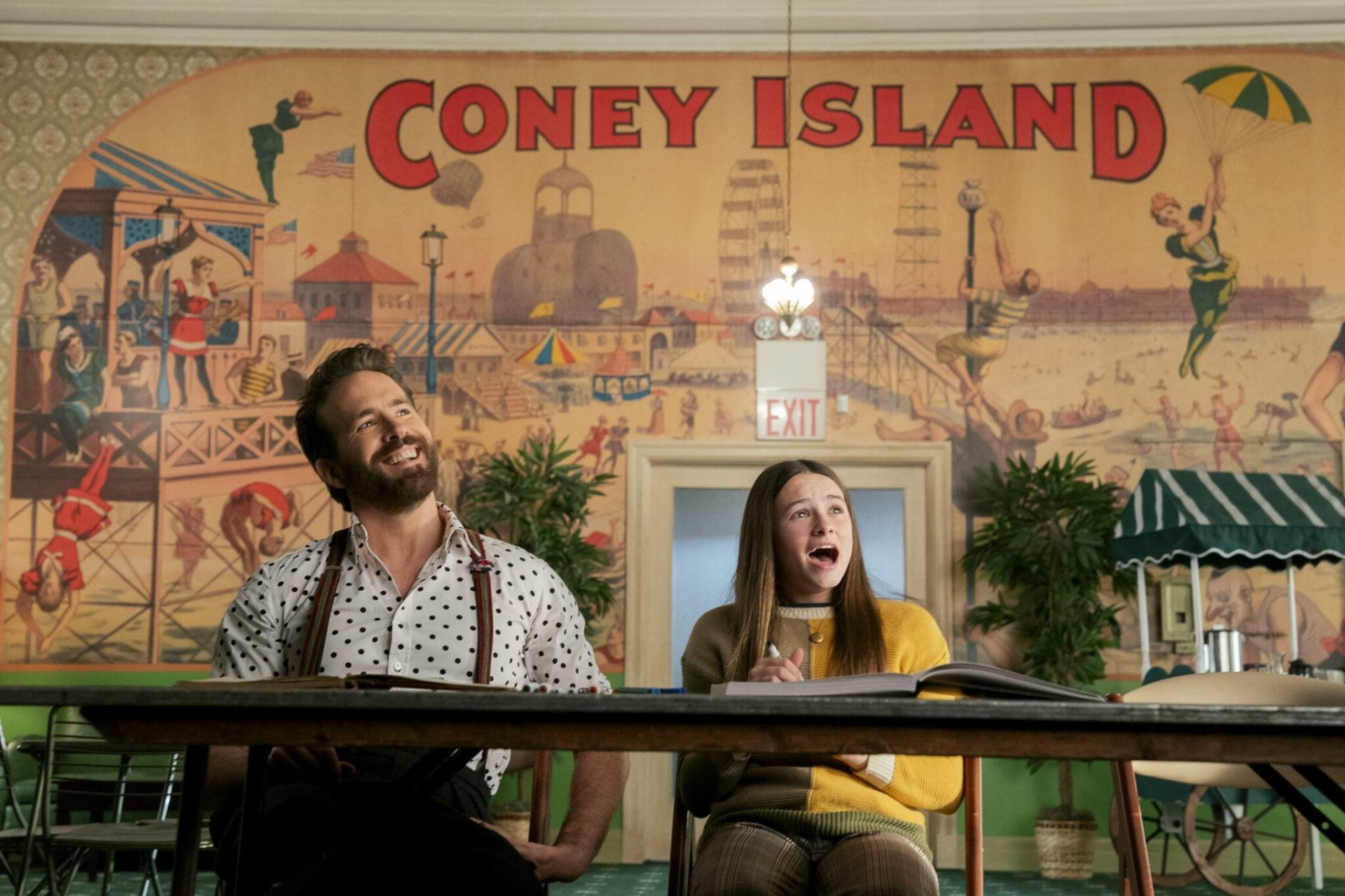 A vibrant HD wallpaper from the 2024 movie IF featuring Ryan Reynolds and Cailey Fleming, set against a lively Coney Island backdrop.