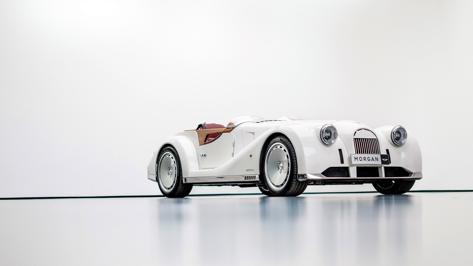 HD desktop wallpaper featuring a white Morgan Midsummer car with an elegant, minimalist background.