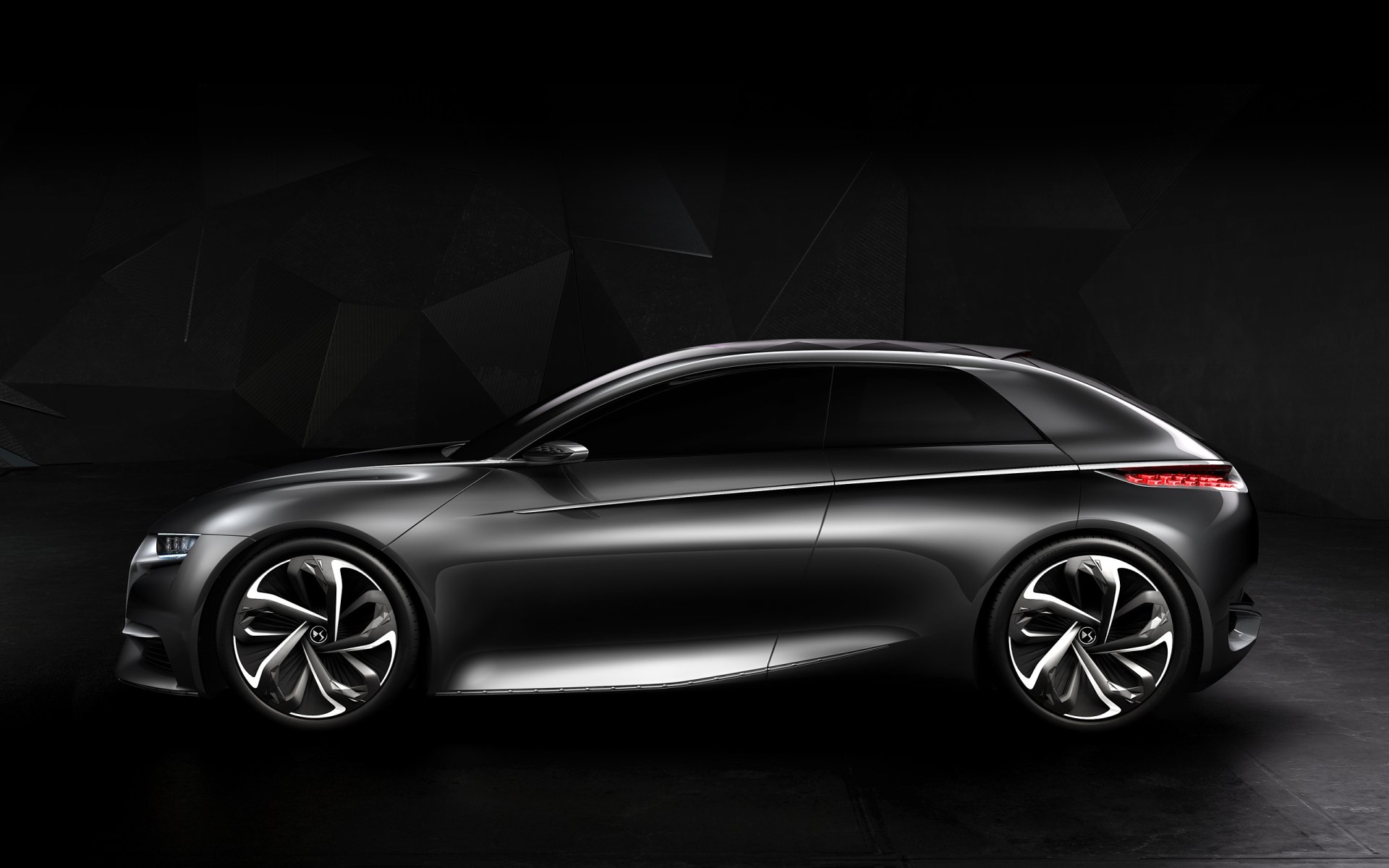 HD desktop wallpaper and background featuring a sleek black Citroën Divine DS car against a dark, geometric background.