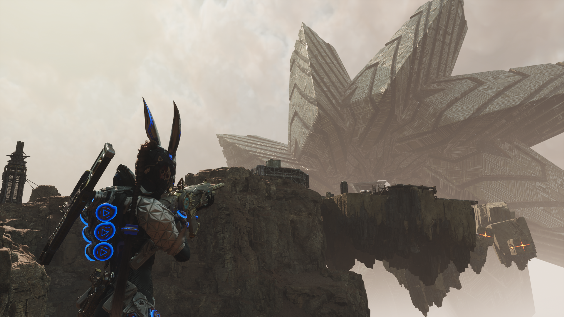 HD wallpaper featuring a scene from the video game The First Descendant, showing an armored character with glowing blue accents exploring a rocky landscape with futuristic structures in the background.