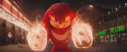 HD desktop wallpaper of Knuckles the Echidna from a TV show, depicted with a serious expression and fists engulfed in flames, set against a nighttime city backdrop.