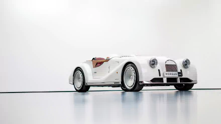HD desktop wallpaper featuring a white Morgan Midsummer car with an elegant, minimalist background.