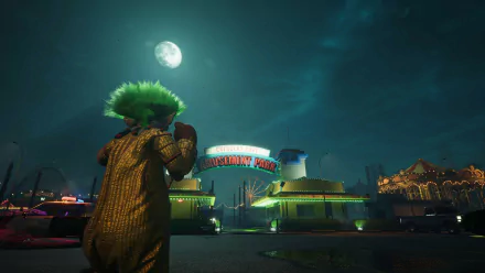 HD wallpaper and background image from Killer Klowns from Outer Space: The Game featuring a menacing clown approaching an illuminated amusement park under a moonlit sky.