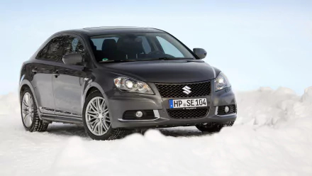 HD desktop wallpaper of a Suzuki Kizashi Sport, featuring a sleek black car positioned against a snowy background.
