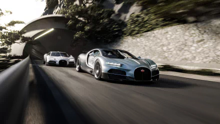 HD desktop wallpaper featuring two sleek Bugatti Tourbillon cars speeding on a curvy road with a tunnel entrance and lush greenery in the background.