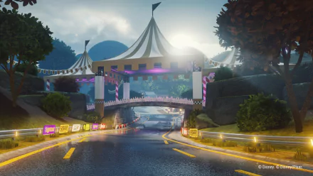 HD desktop wallpaper featuring a vibrant race track from the video game Disney Speedstorm, showcasing a scenic road with a circus tent bridge and lush greenery.