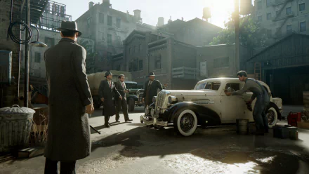HD wallpaper and background from Mafia: Definitive Edition featuring a vintage car and men in suits in an urban setting.